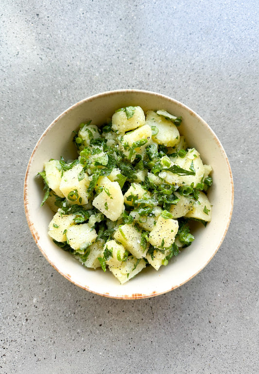 traditional greek potato salad with parsley and spring onion